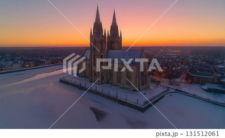 Snow-Covered Cathedral Towers Under a Vibrant Sunset Sky in Wint 131512061