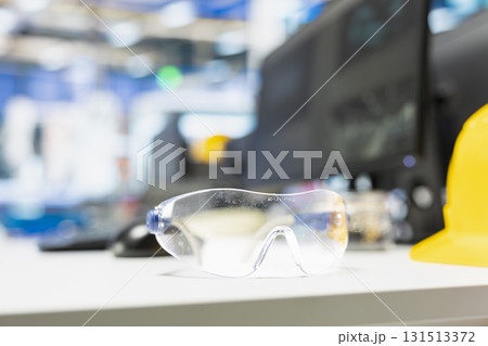 Empty high tech desk with safety glasses in a solar power facility, ensuring a great manufacturing process. Solar energy automation for sustainable solutions, renewable energy. Close up. 131513372