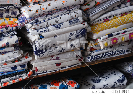 heap of colorful cloth on shelf for sale in store heap of colorful cloth on shelf for sale in store 131513996