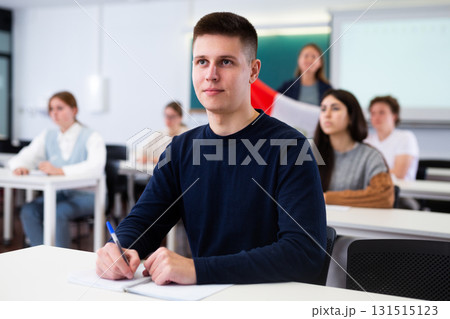 Young boy student studying diligently at school 131515123