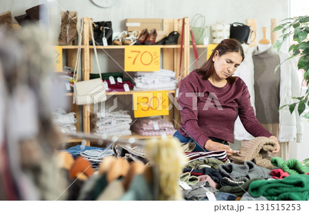 During November sales, Latin woman choose something warm clothes During November sales, Latin woman choose something warm clothes 131515253