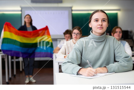 Teacher explaining meaning of LGBT flag to students 131515544