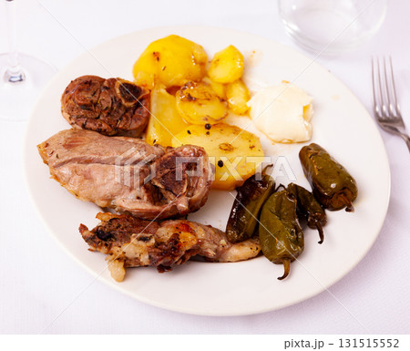 Roasted lamb leg served with grilled organic vegetable and peppe closeup 131515552