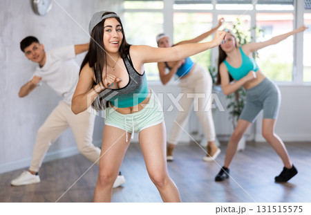 Dance class for teenages, positive girl and boy training in studio Dance class for teenages, positive girl and boy training in studio 131515575
