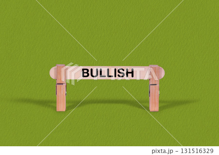 Bullish symbol. Wooden stick anchored by Clothespins, Cool Green Background. Business and Bullish concept with copy space Bullish symbol. Wooden stick anchored by Clothespins, Cool Green Background. Business and Bullish concept with copy space 131516329