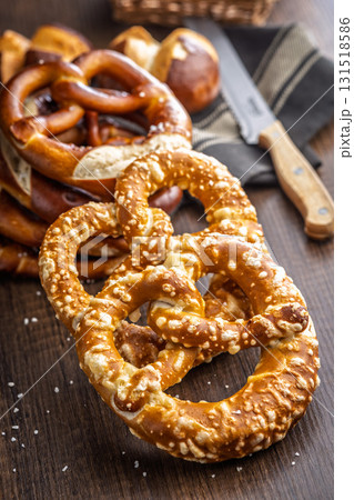 Salted bavarian pretzel on wooden table. 131518586