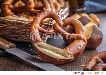 Salted bavarian pretzel on wooden table. 131518592