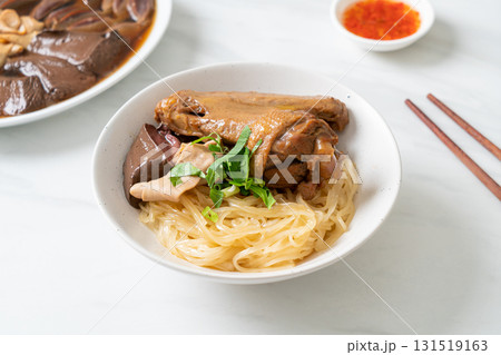 dried noodles with braised duck in white bowl dried noodles with braised duck in white bowl 131519163