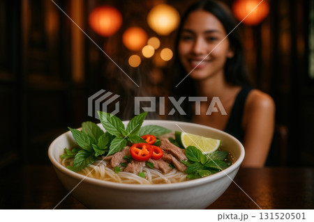 Steaming Beef Pho with Herbs and Chili in Cozy Lantern-Lit Eatery Steaming Beef Pho with Herbs and Chili in Cozy Lantern-Lit Eatery 131520501