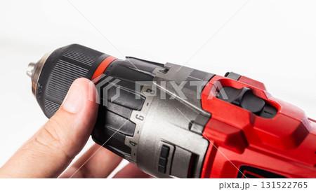 Adjusting the screwing power in a modern drill screwdriver, close-up, industry 131522765