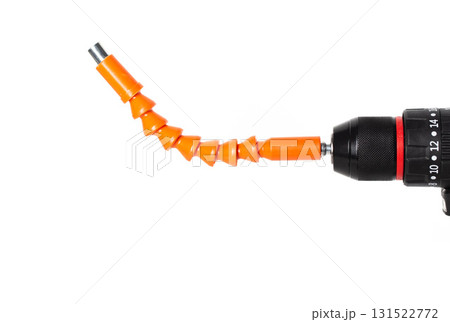 Flexible orange attachment on a power drill designed for precision tasks in home improvement projects, isolate Flexible orange attachment on a power drill designed for precision tasks in home improvement projects, isolate 131522772