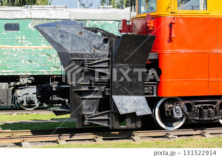 A snow plow train for clearing snow from railroad tracks in winter, close-up 131522914