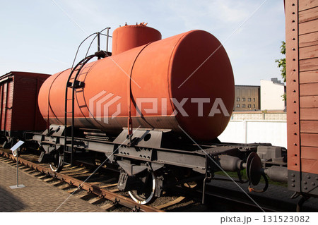 Historic transport tank on railway tracks in an outdoor museum setting 131523082