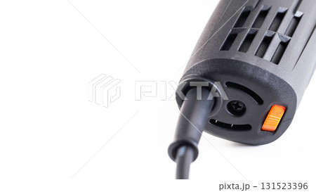 Speed controller on the grinder body on a white background, industry. Copy space for text, protective Speed controller on the grinder body on a white background, industry. Copy space for text, protective 131523396