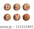A collage of five bread loaves with currency symbols 131523805