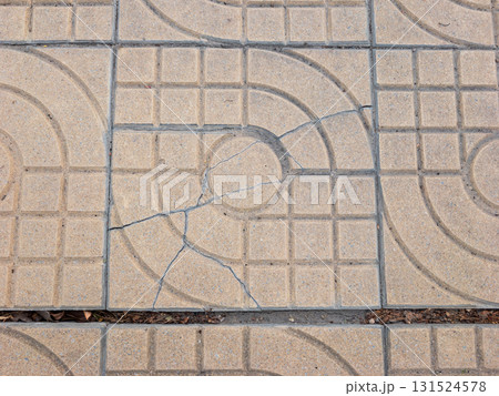 Damaged Park Walkway Tile with Crack. Damaged Park Walkway Tile with Crack. 131524578