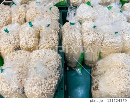 Fresh Enoki Mushrooms in Market Display. Fresh Enoki Mushrooms in Market Display. 131524579