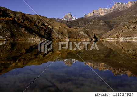 Panorama of autumn mountains with terracotta slopes and a clear lake Panorama of autumn mountains with terracotta slopes and a clear lake 131524924