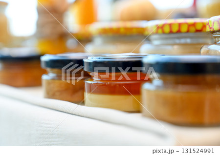 Homemade honey and jam in glass jars Homemade honey and jam in glass jars 131524991