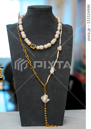 A set of multi-layered handmade necklaces with beads and pendants 131524996