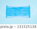 Blue medical mask, top view on blue background, healthcare, safety, and protective face mask concept 131525138