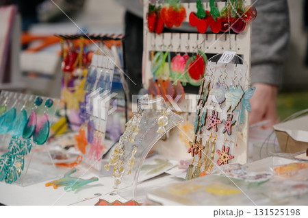 A close-up of a display case with handmade jewelry 131525198