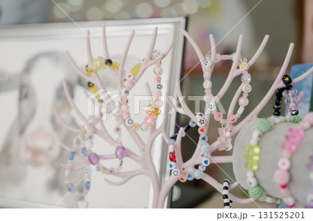 A collection of children's beaded bracelets with cute figures and hearts. 131525201