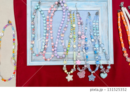 A collection of children's beaded bracelets with cute figures and hearts. A collection of children's beaded bracelets with cute figures and hearts. 131525352