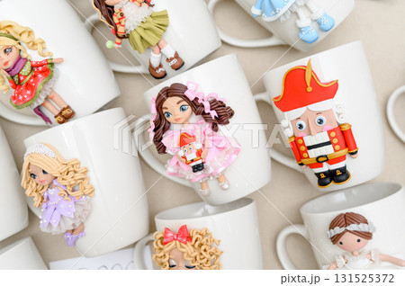 White mugs decorated with polymer clay fairy tale characters White mugs decorated with polymer clay fairy tale characters 131525372
