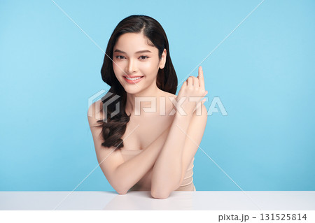 Beautiful Young transgender woman with clean fresh skin on blue background, Face care, Facial treatment, Cosmetology, beauty and spa, transgender women portrait. Beautiful Young transgender woman with clean fresh skin on blue background, Face care, Facial treatment, Cosmetology, beauty and spa, transgender women portrait. 131525814