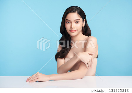 Beautiful Young transgender woman with clean fresh skin on blue background, Face care, Facial treatment, Cosmetology, beauty and spa, transgender women portrait. Beautiful Young transgender woman with clean fresh skin on blue background, Face care, Facial treatment, Cosmetology, beauty and spa, transgender women portrait. 131525818