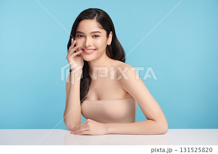 Beautiful Young transgender woman with clean fresh skin on blue background, Face care, Facial treatment, Cosmetology, beauty and spa, transgender women portrait. Beautiful Young transgender woman with clean fresh skin on blue background, Face care, Facial treatment, Cosmetology, beauty and spa, transgender women portrait. 131525820