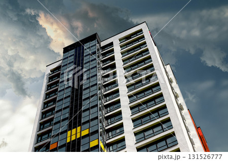 High rise condominium in developing metropolitan neighborhood. Tall residential and commercial tower 131526777