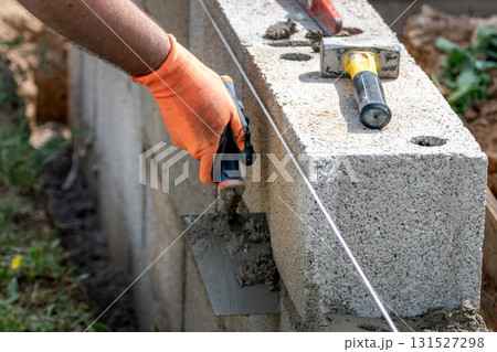 Handyman working on a construction site with tools 131527298