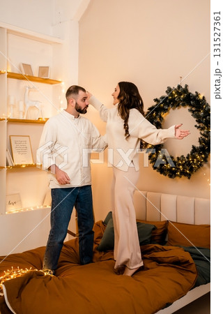 Joyful Couple Enjoying Time Together in Cozy Bedroom 131527361