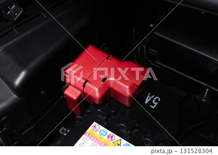 Car battery positive terminal with red protective cover 131528304