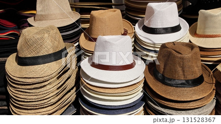 A variety of summer men's hats in a street market. A variety of summer men's hats in a street market. 131528367