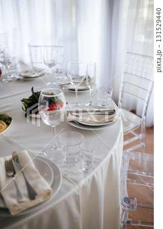 Elegant Table Setting with Glassware and Napkins Elegant Table Setting with Glassware and Napkins 131529440