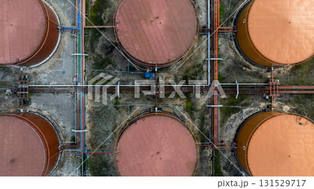 Aerial view white oil storage tank with pipeline steel, Crude oil industry, Storage fuel gas container tank petroleum refinery industrial factory, Oil storage chemical petrochemical refinery product. 131529717