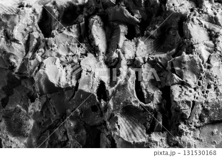 A stone surface with deep cracks A stone surface with deep cracks 131530168