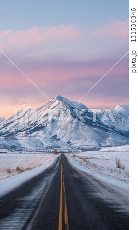 Snowy Mountain Landscape With Road Leading To Horizon At Sunrise. Serene Winter Travel Scene 131530346