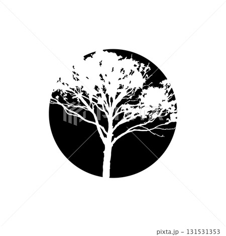 Black and white silhouette of a tree within a circular frame 131531353