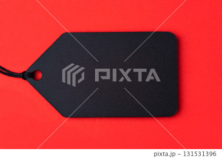 Empty black tag on red background Empty black tag on red background 131531396