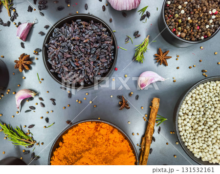 Bright spices and herbs arranged beautifully on a kitchen countertop for flavorful cooking exploration in a home setting Bright spices and herbs arranged beautifully on a kitchen countertop for flavorful cooking exploration in a home setting 131532161