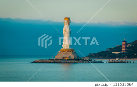 Guanyin statue at seaside in nanshan temple, hainan island , China. Words mean mercy and blessing. 131533064