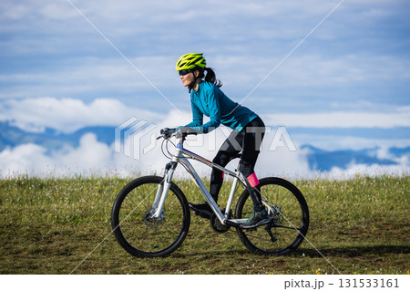 Riding mountain bike on beautiful mountain top 131533161