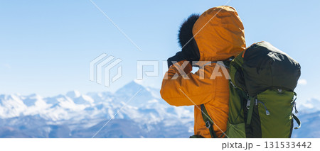 Successful woman photographer taking picture of Mount Everest in Tibet, China Successful woman photographer taking picture of Mount Everest in Tibet, China 131533442