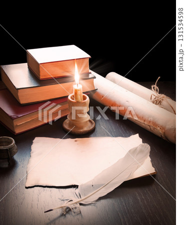 Books and candle on the table Books and candle on the table 131534598