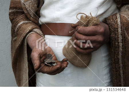 Ancient man with silver coins 131534648
