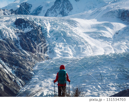 Backpacking woman hiking on winter high altitude mountain top Backpacking woman hiking on winter high altitude mountain top 131534703